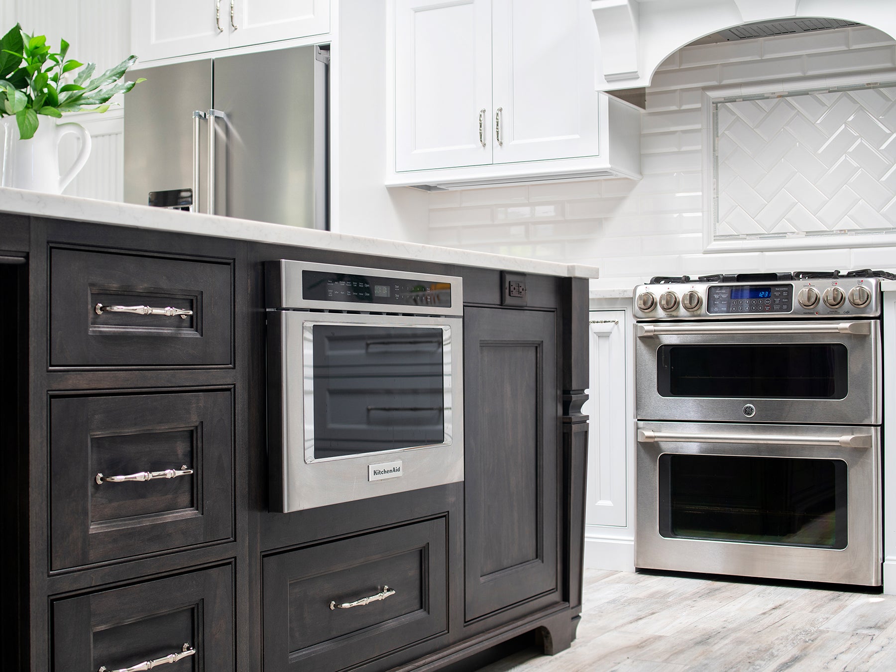 Contemporary kitchen design featuring Shiloh cabinets, stainless steel appliances, and marble countertops.