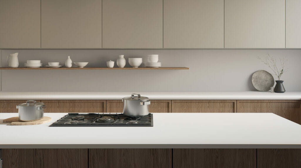 Modern kitchen featuring a minimalist design with a sleek 110 Whitenna countertop and elegant porcelain tableware.