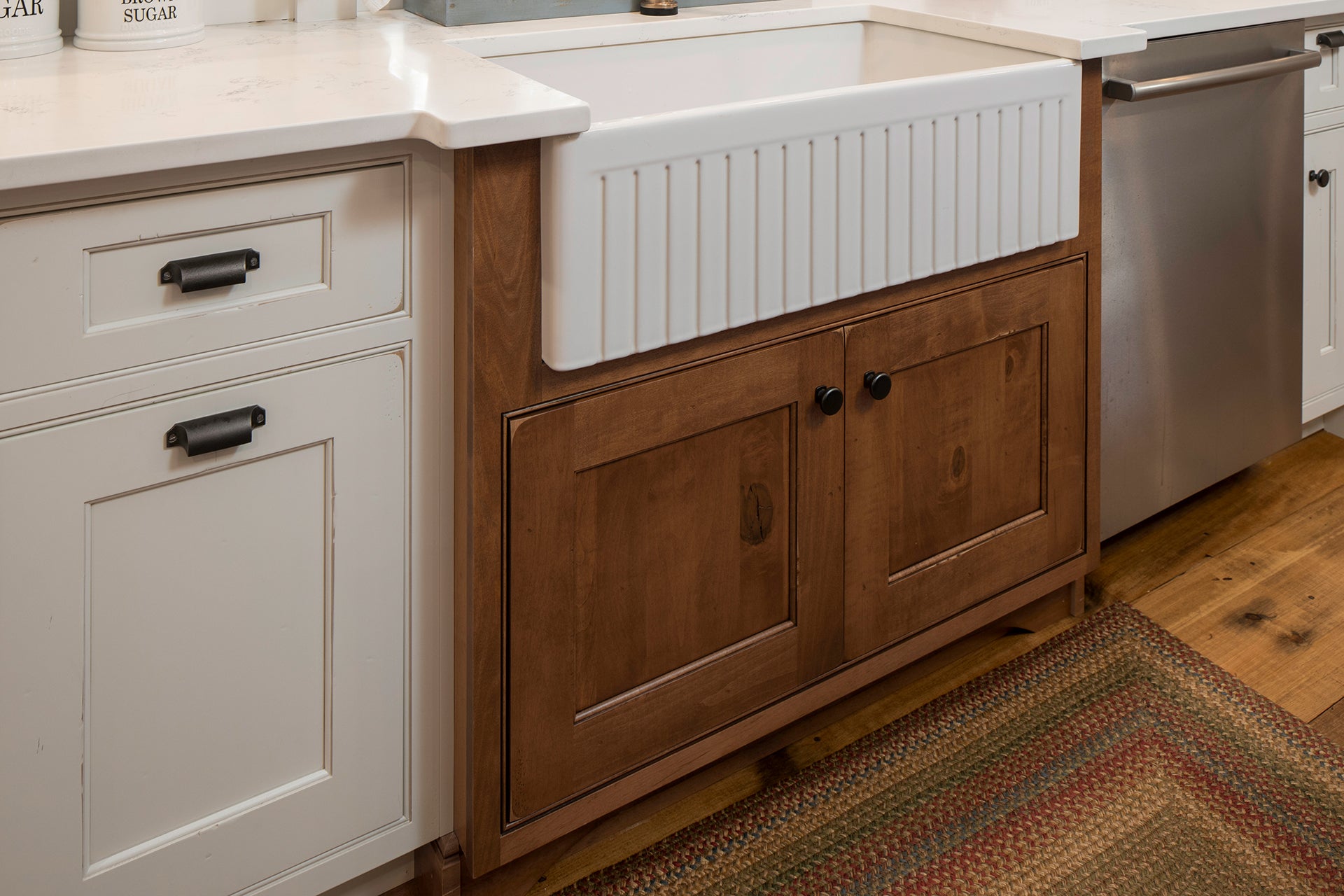 Custom Shiloh cabinet with wood finish and farmhouse sink, perfect for kitchen designs and renovations.