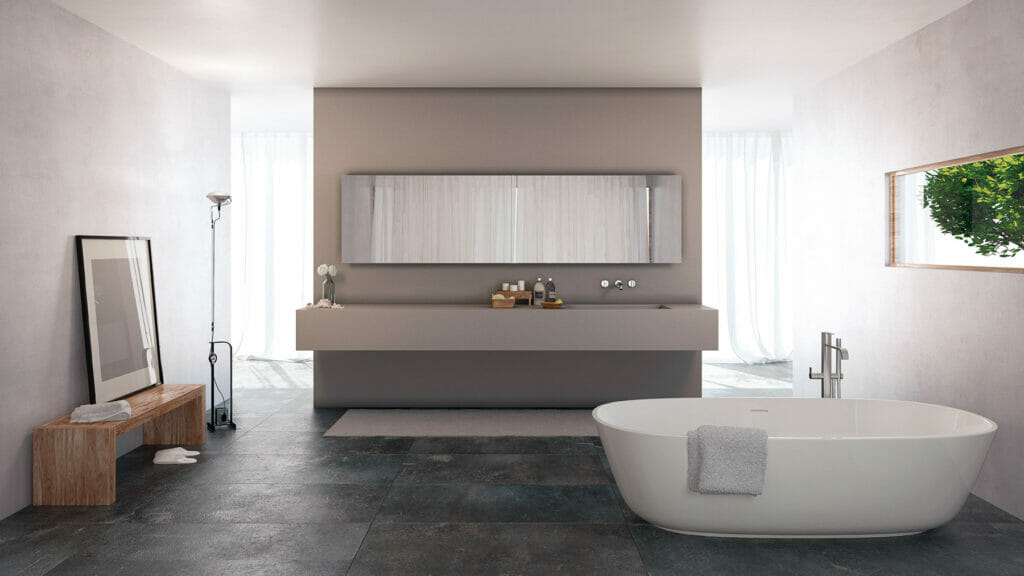 Modern bathroom featuring sleek concrete walls, a freestanding bathtub, and elegant finishing for an industrial look.