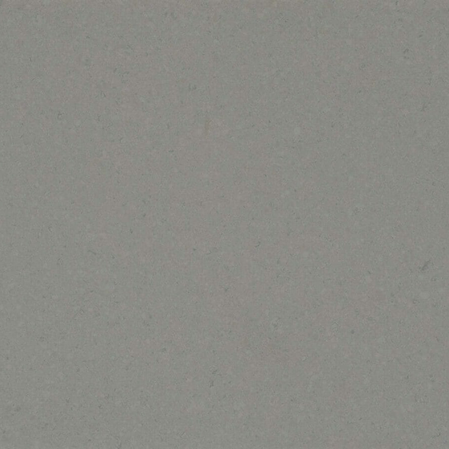 4030 Pebble: a soft ashen surface featuring darker quartz chips for a clean and modern aesthetic.