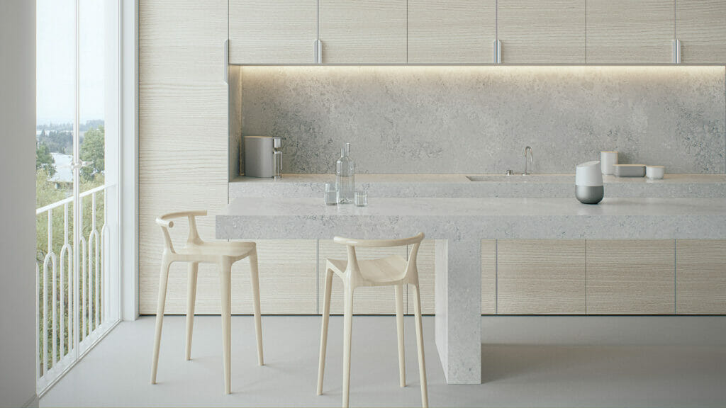 Modern kitchen featuring airy concrete countertop with swirling textures, complemented by minimalist decor and natural light.