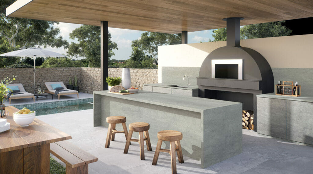 Modern outdoor kitchen featuring 410 Aluminous concrete countertops with a soft stony appearance and Ultra Rough finish.