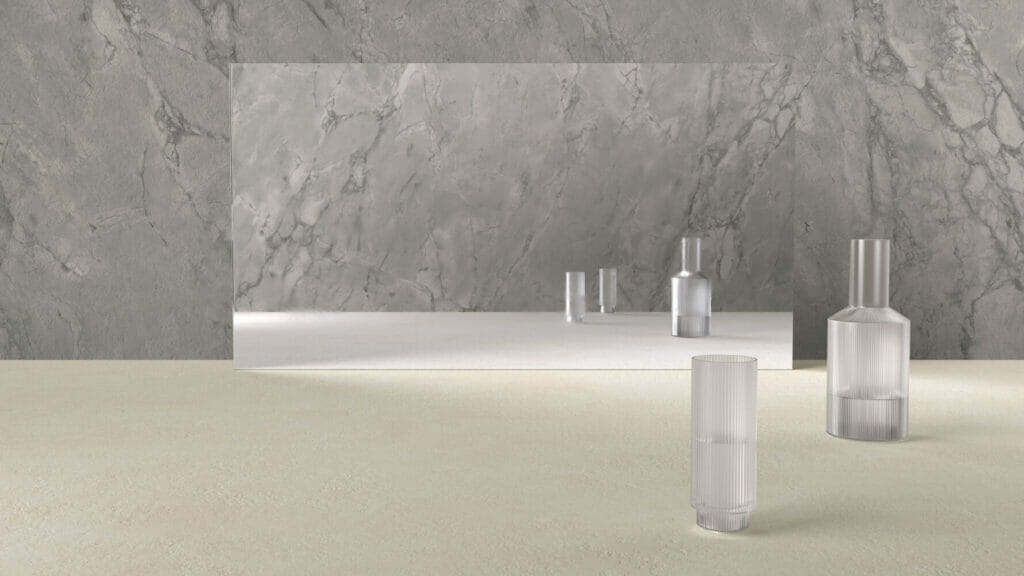 Creamy-beige backdrop with marble wall and clear glass vases, showcasing a warm concrete texture in Ultra Rough finish.