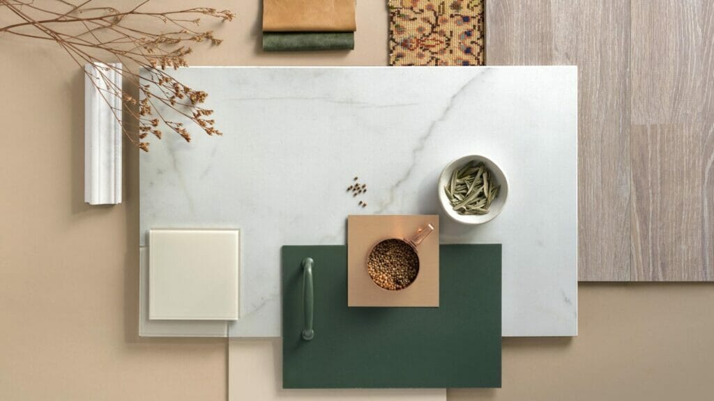 Stylish tabletop featuring a pearl-white backdrop with dark grey veins, showcasing various materials and decorative elements.