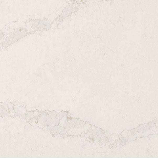 5115 Calacatta Stillstorm surface showing bright white base with subtle grey veins and silvery clouds for elegant designs.