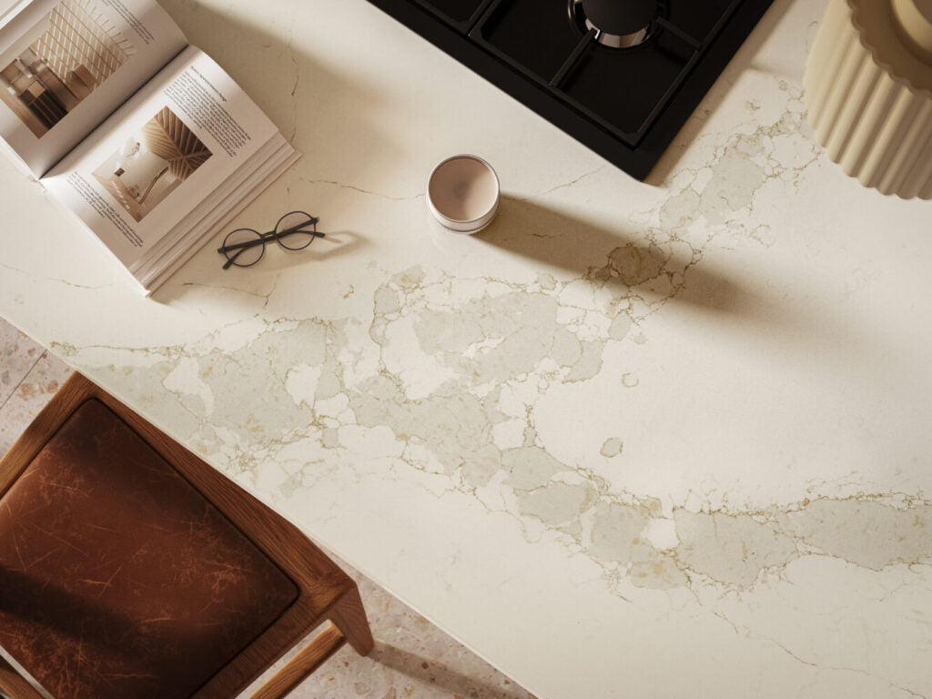Elegant Calacatta Nectar countertop featuring light grey veins on a radiant white surface, enhancing modern kitchen decor.