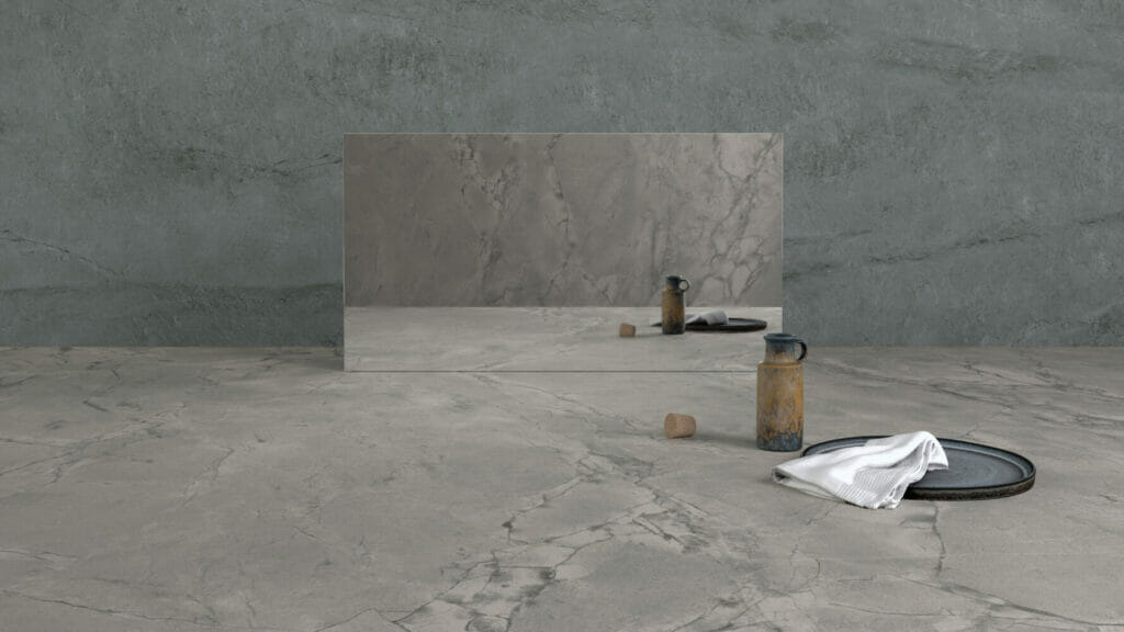 512 Transcenda oversized marble finish with grey clusters and white highlights, showcasing a sleek, organic aesthetic in a modern setting.