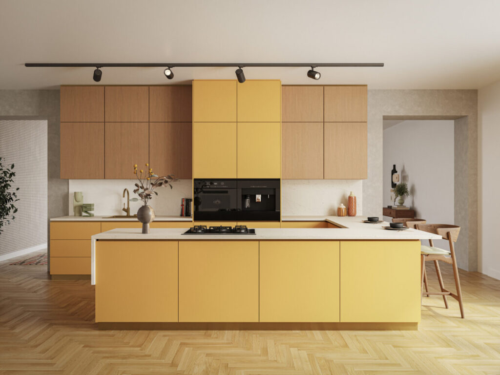 Modern kitchen featuring yellow cabinets, a sleek black stove, and wooden flooring, creating a vibrant and stylish space.
