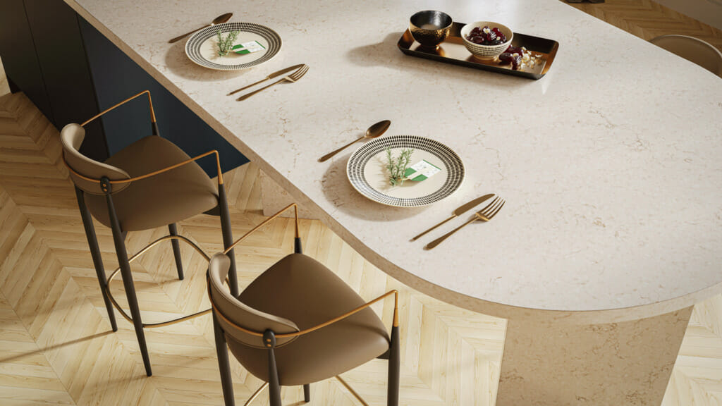 Elegant dining setup featuring a marble countertop, stylish chairs, and tasteful dinnerware on a wooden floor.