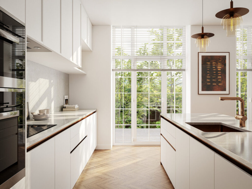 Modern kitchen featuring white cabinets, large windows, and stylish pendant lighting, enhancing natural light.