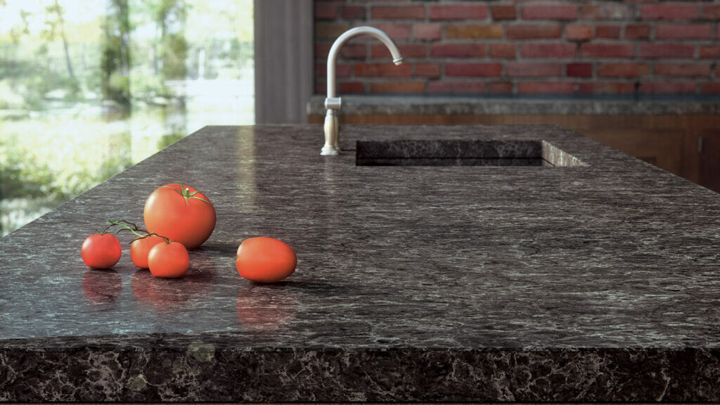 Coastal Grey countertop featuring fresh tomatoes, showcasing textured depth and dynamic dark backdrop.