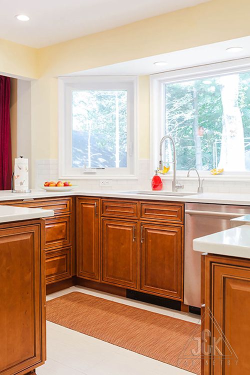 Mocha Glazed cabinets and vanities in a bright kitchen, showcasing 100% solid wood construction.