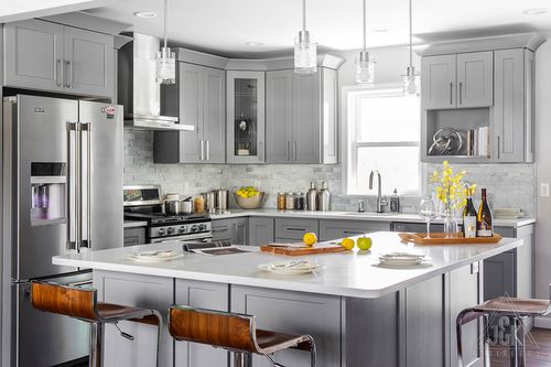 Modern kitchen featuring Castle Grey cabinets, solid wood construction, sleek design, and stylish bar seating.