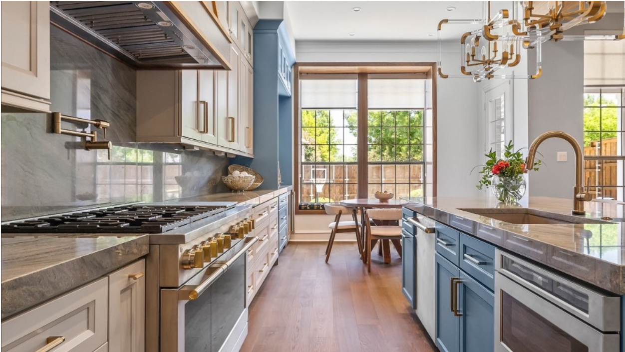 Stylish kitchen featuring solid wood cabinets, modern appliances, and natural light from large windows.