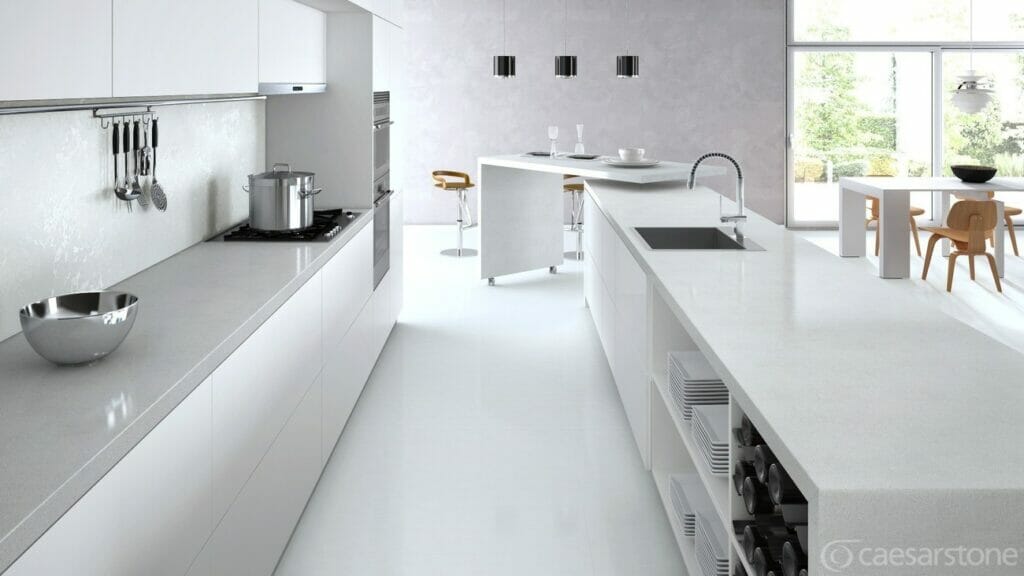 Modern kitchen design featuring white cabinets and countertops with neutral mineral accents.