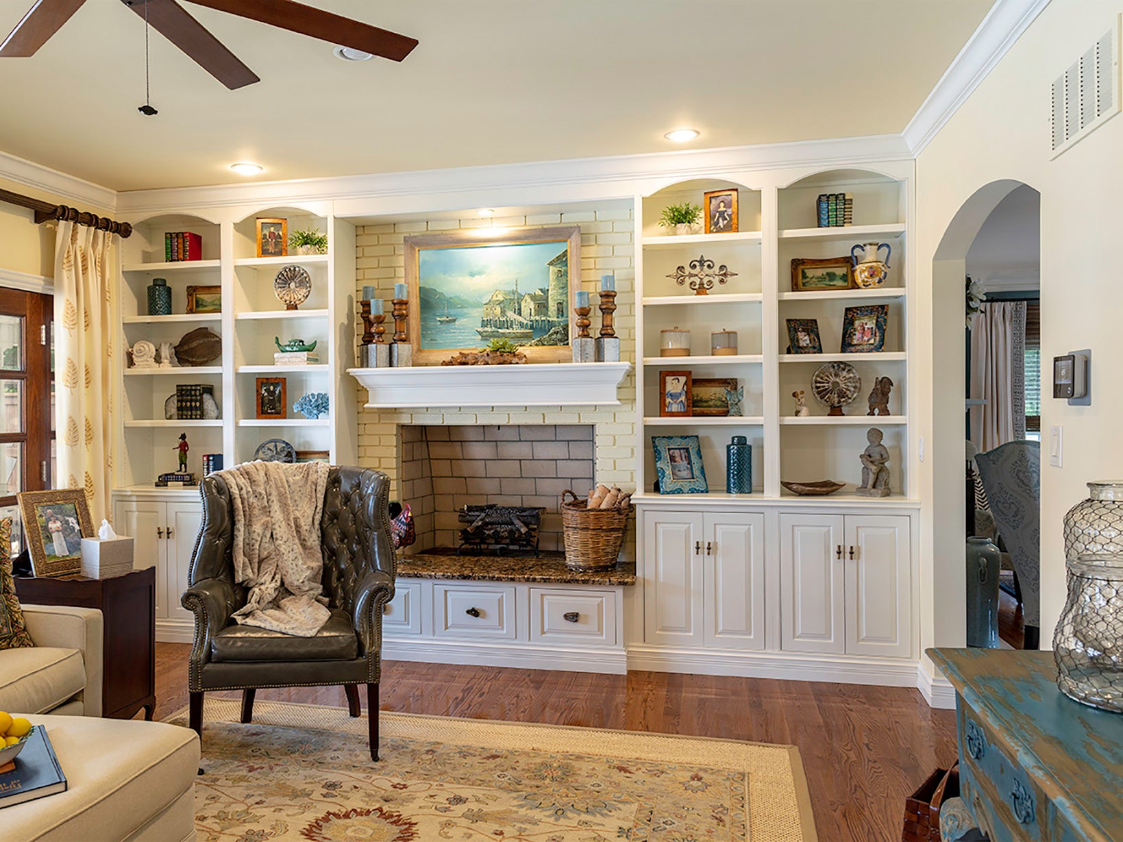 Cozy living room featuring built-in shelves, a stylish fireplace, and comfortable seating, ideal for home decor inspiration.