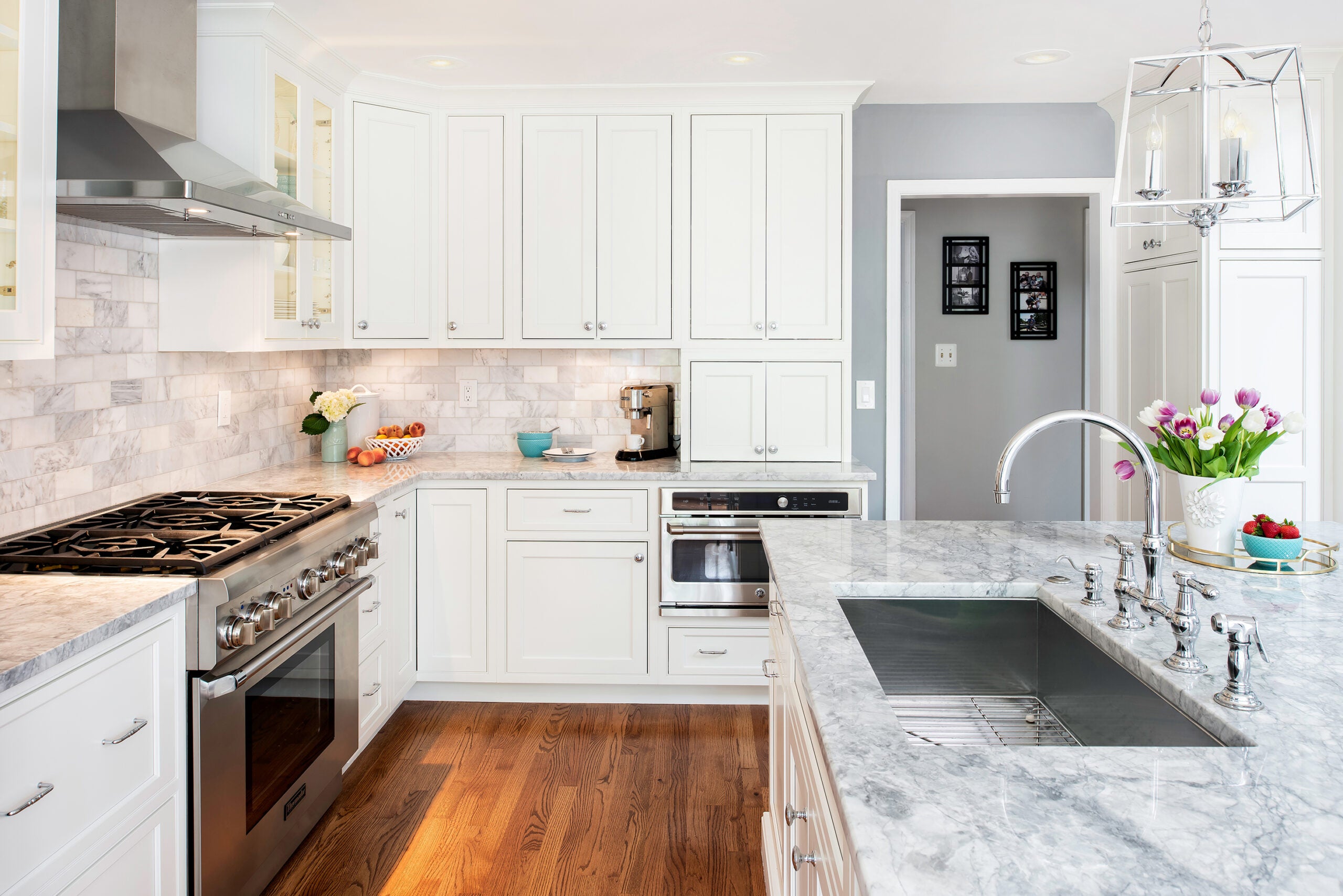 Stylish kitchen featuring Shiloh cabinets with white cabinetry, marble countertops, and modern appliances for a sleek look.