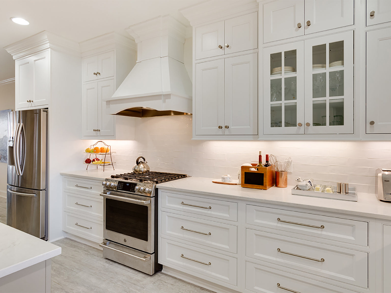 Modern kitchen featuring customizable Shiloh cabinets in white with a sleek stove and stylish appliances.