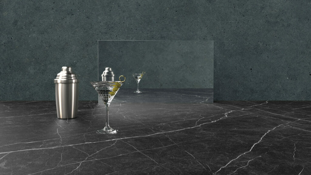 Stylish bar setup featuring the 220 Magnate slate surface with a cocktail shaker and glass on display.