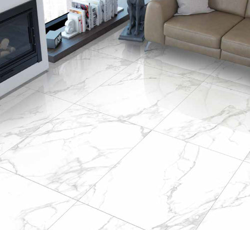 High polished Carrara pearl tile flooring in modern living room setting with fireplace and elegant furnishings.