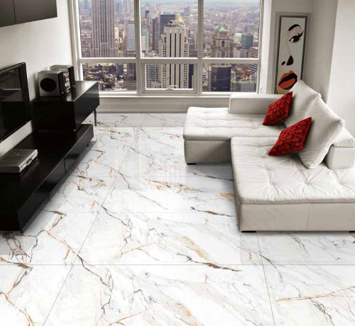 Infinity Calacutta Polished Tile in a modern living room setting with white furniture and city view.