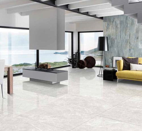 Meta Bianco polished tile showcased in a modern living room with scenic views and stylish decor.