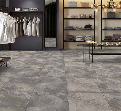 Sefia Grey Tile polished flooring in a modern retail space showcasing fashion apparel and stylish home decor.