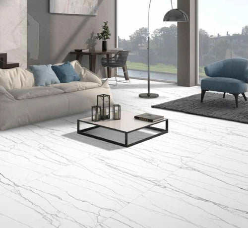 Modern living room showcasing Spyder Grey tile flooring with stylish furniture and natural light.