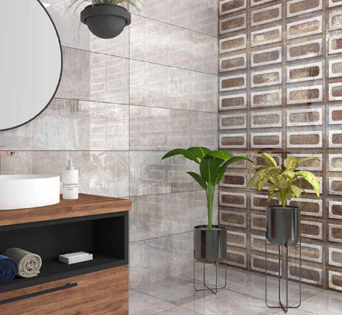 Stantio Bengal Perla Dark Tile in matte finish showcased in a stylish bathroom with plants and modern decor.