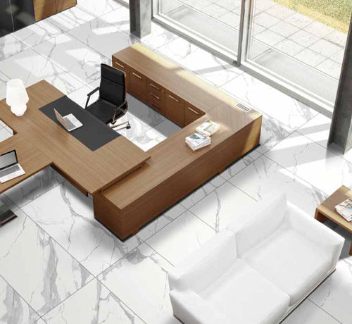 Modern office space featuring Statuario Grace tile flooring, elegant furniture, and natural light.