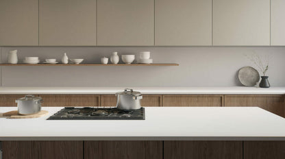 Modern kitchen featuring a minimalist design with a sleek 110 Whitenna countertop and elegant porcelain tableware.