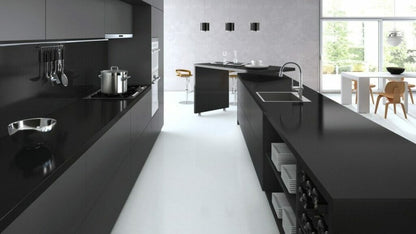 Modern kitchen with sleek 3100 Jet Black surfaces and sophisticated design, showcasing luxury and elegance.