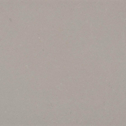 4004 Raw Concrete fabric with soft grey and textured flecks of black and white, perfect for urban aesthetics.