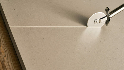 Close-up of 4004 Raw Concrete surface with soft grey tones and textured flecks, showcasing urban elegance.