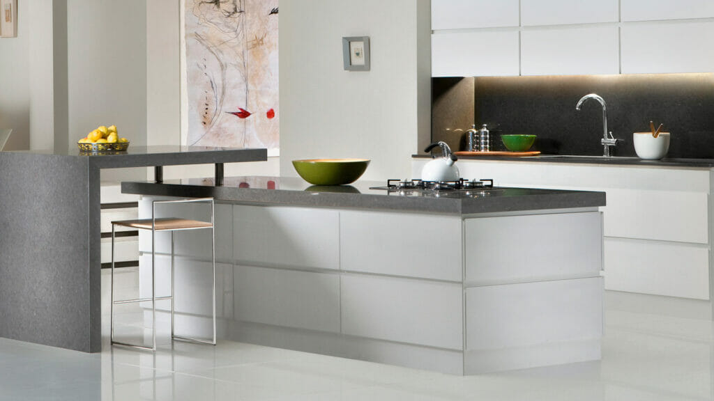 Modern kitchen featuring sleek cabinetry, stone countertops, and stylish bowl accents in a minimalist design.