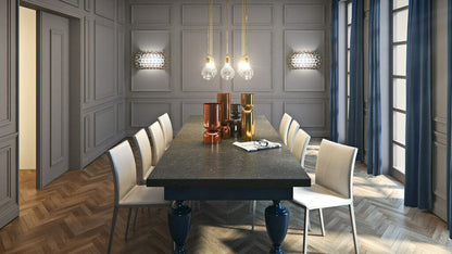 Stylish dining room featuring 5003 Piatra Grey slate table with elegant lighting and modern decor.