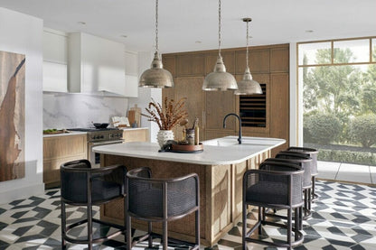 Elegant kitchen featuring a Statuario Maximus island, modern cabinetry, and stylish seating for a sophisticated atmosphere.