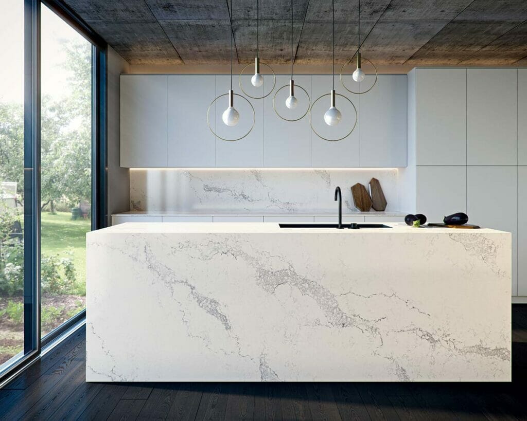 Statuario Maximus kitchen island featuring dove-white surface with light-grey veins, modern design, and natural light.