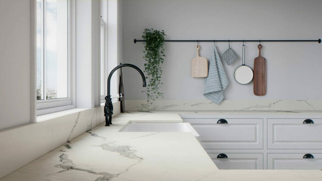 Modern kitchen featuring a pure white countertop with bold light-grey veining and stylish decor.