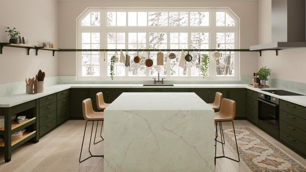 Modern kitchen featuring a pearl-white countertop with dark grey veins, green cabinets, and large windows for natural light.