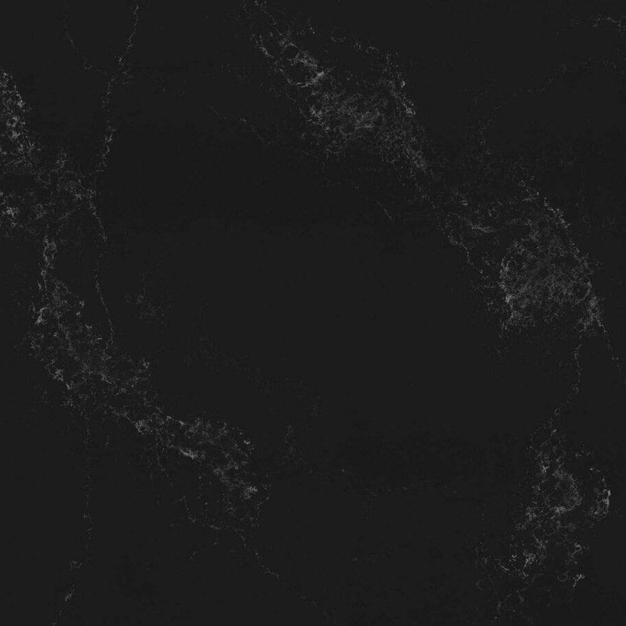 Deep black stone surface, featuring white veining for a unique, opulent look in any space.
