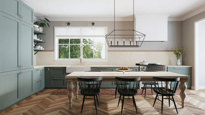 Modern kitchen featuring misty white countertops, blue cabinetry, and a spacious dining area with black chairs.
