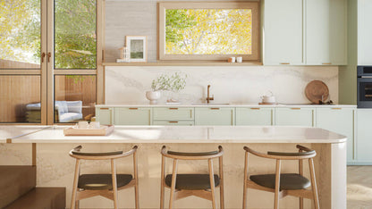 Bright kitchen featuring Calacatta Stillstorm countertop with greenish yellow accents and pale grey veining.