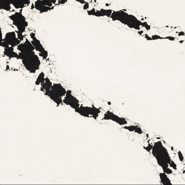 5118 Calacatta Scoria marble with bold black veins on bright white backdrop, showcasing dynamic organic textures.
