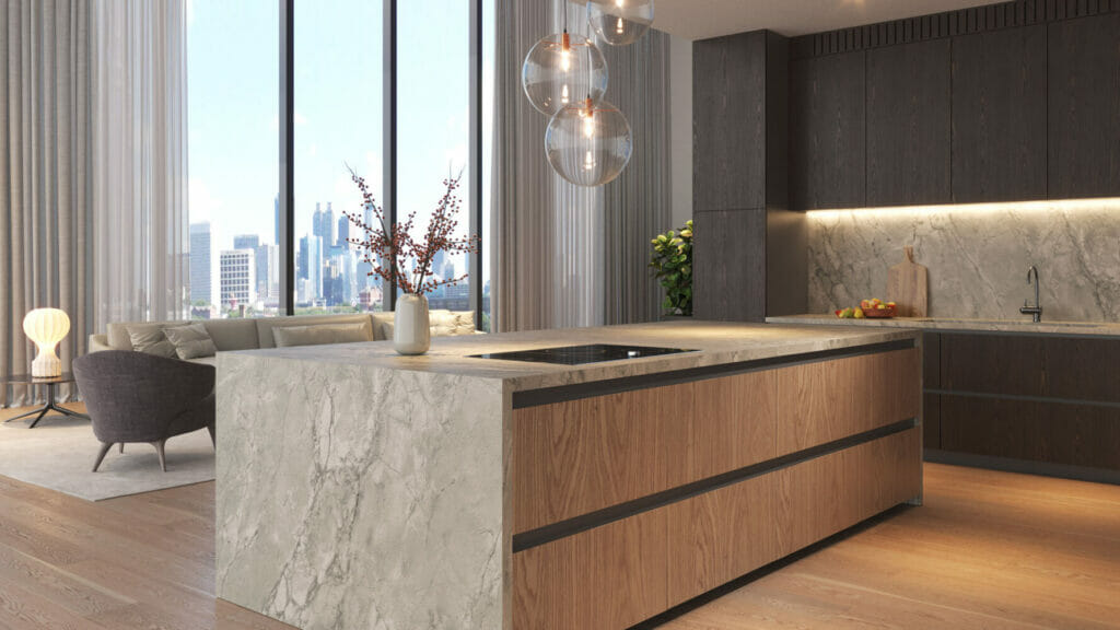 Modern kitchen featuring a sleek oversized marble island with wooden cabinetry and stunning city views.