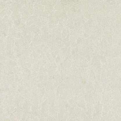 5130 Cosmopolitan White surface featuring delicate cream tones with elegant ashen streaks and speckles.