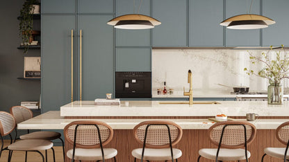 Modern kitchen featuring a creamy white island, blue cabinetry, and stylish seating, exuding contemporary elegance.