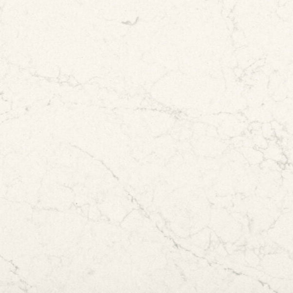Dreamy Carrara surface showcasing silky white base with subtle off-white and light grey veins.