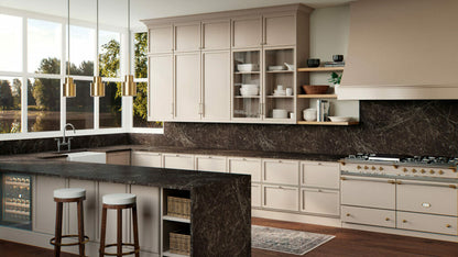 Modern kitchen featuring earthy-toned cabinets and a dark stone countertop with natural veins and textures.